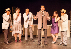 Pictured left to right: Ae’Jay Mitchell, Kathryn Wood, Kim Larsen, Rudy Guerrero* as Wilson Mizner, Kate McCarthy, and Justin Lucas in ROAD SHOW music and lyrics by Stephen Sondheim, book by John Weidman, directed by John Fisher, photo by David Wilson; A Theatre Rhinoceros Production at the Eureka Theatre.
*Member Actors’ Equity Association.
