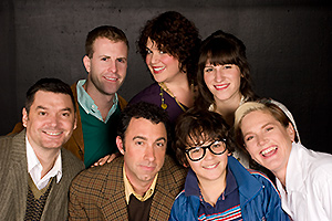 Pictured: (top row, left to right) Scott Gessford as Whizzer, Leanne Borghesi as Trina, Amanda Dolan as Cordelia, (bottom row, left to right) Christian Bohm as Marvin, Christopher M. Nelson as Mendel, David Kahawaii as Jason, and Laurie Bushman as Dr. Charlotte in "Falsettos", by William Finn and James Lapine, at Theatre Rhinoceros.  Directed by Hector Correa; musical direction by Mark Hanson.  Photo by Kent Taylor.