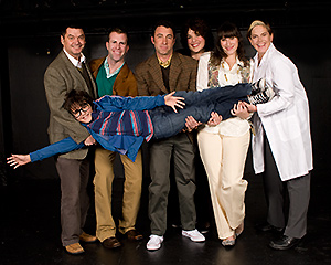 Pictured: (standing, left to right) Christian Bohm as Marvin, Scott Gessford as Whizzer, Christopher M. Nelson as Mendel, Leanne Borghesi as Trina, Amanda Dolan as Cordelia, Laurie Bushman as Dr. Charlotte, and (being held) David Kahawaii as Jason in "Falsettos", by William Finn and James Lapine, at Theatre Rhinoceros.  Directed by Hector Correa; musical direction by Mark Hanson.  Photo by Kent Taylor.
