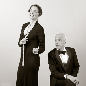 Pictured left to right: Sylvia Kratins as Carlotta Gray and John Fisher as Sir Hugo Latymer in Noël Coward’s A Song at Twilight. A Theatre Rhinoceros Production at Z Below. Photo by David Wilson. 